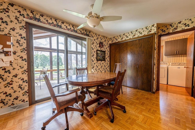 dining room featuring washing machine and dryer, a ceiling fan, visible vents, and wallpapered walls