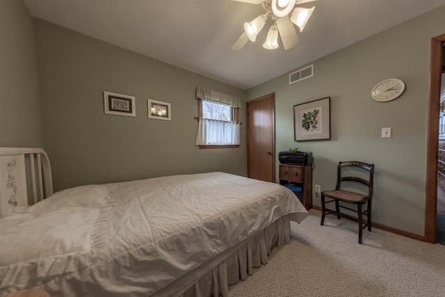 bedroom featuring a closet, a ceiling fan, visible vents, carpet, and baseboards