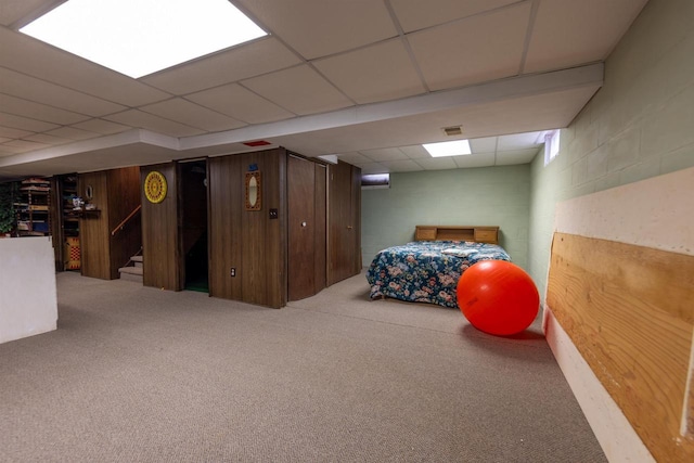 bedroom with visible vents, a paneled ceiling, and carpet floors
