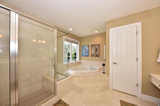 bathroom featuring a garden tub, recessed lighting, tile patterned floors, and a shower stall