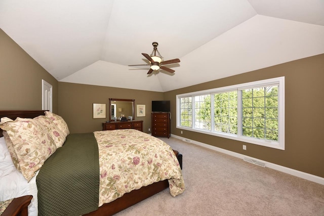 bedroom featuring ceiling fan, light carpet, visible vents, baseboards, and vaulted ceiling