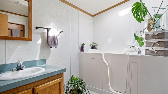 23603 69th Ave, Cadott, WI 54727 - bathroom featuring crown molding, a garden tub, visible vents, and vanity