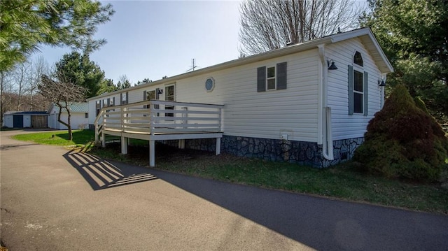 23603 69th Ave, Cadott, WI 54727 - back of property featuring a wooden deck