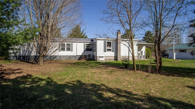 23603 69th Ave, Cadott, WI 54727 - manufactured / mobile home featuring a chimney and a front yard