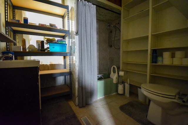 bathroom with tile patterned floors, shower / bath combo with shower curtain, toilet, vanity, and visible vents