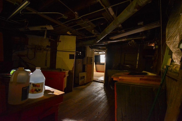 basement with wood-type flooring