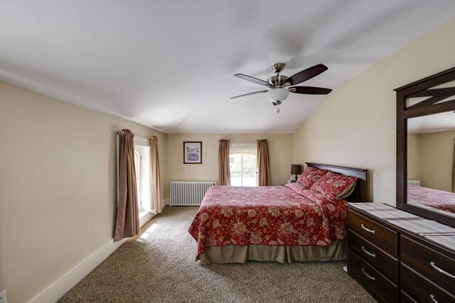 229 N Ludington St, Columbus, WI 53925 - bedroom with carpet floors, ceiling fan, lofted ceiling, and radiator