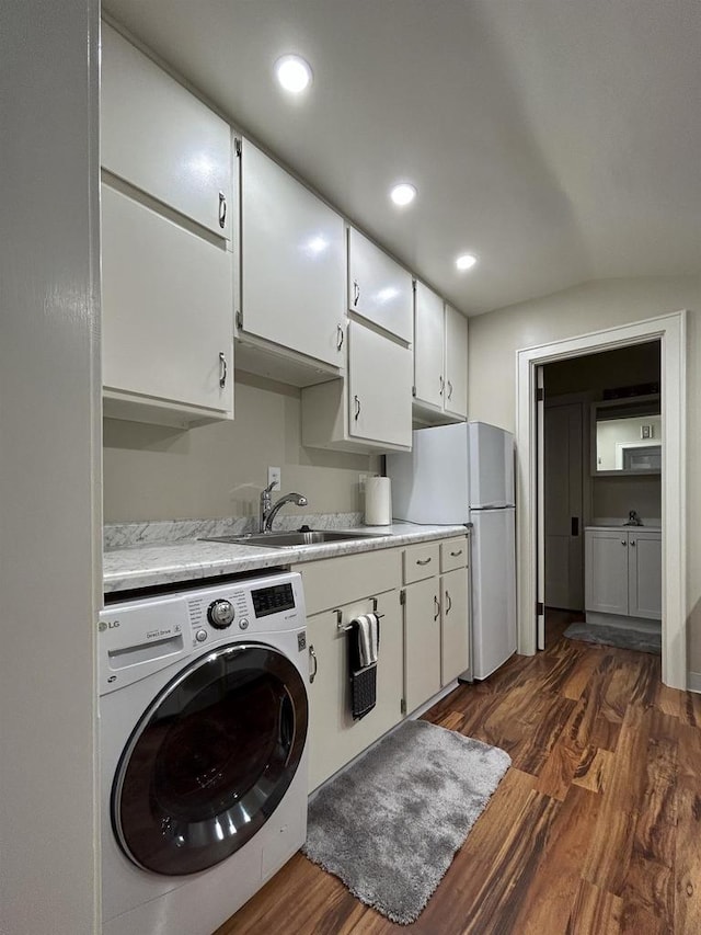 229 N Ludington St, Columbus, WI 53925 - washroom with laundry area, dark wood finished floors, a sink, washer / dryer, and recessed lighting