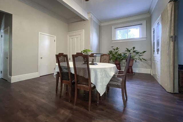 229 N Ludington St, Columbus, WI 53925 - dining space with baseboards, ornamental molding, and wood finished floors