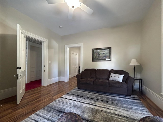 229 N Ludington St, Columbus, WI 53925 - living room featuring baseboards, ceiling fan, and wood finished floors