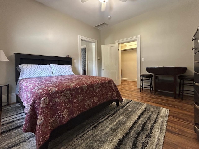 229 N Ludington St, Columbus, WI 53925 - bedroom featuring baseboards, ceiling fan, and wood finished floors