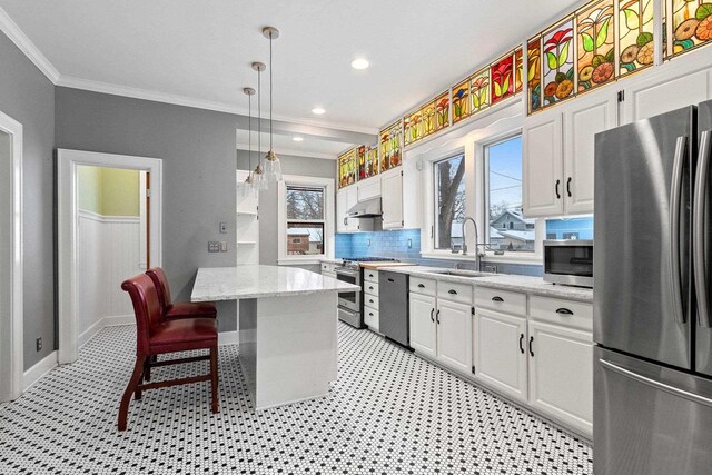 745 S Quincy St, Green Bay, WI 54301 - kitchen with appliances with stainless steel finishes, under cabinet range hood, white cabinets, and a sink