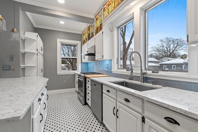 745 S Quincy St, Green Bay, WI 54301 - kitchen with tasteful backsplash, stainless steel appliances, open shelves, a sink, and white cabinetry