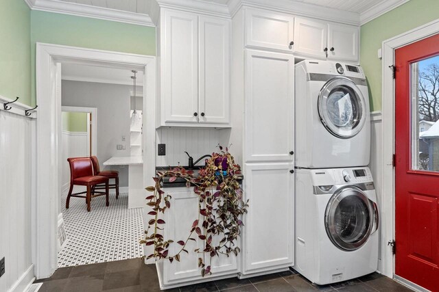 745 S Quincy St, Green Bay, WI 54301 - clothes washing area featuring stacked washer / dryer and crown molding