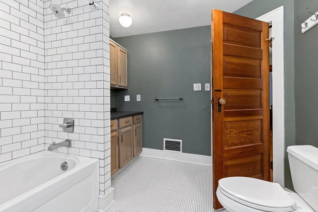 745 S Quincy St, Green Bay, WI 54301 - full bathroom featuring visible vents, baseboards, toilet, tile patterned floors, and  shower combination