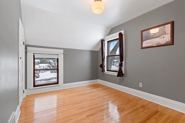 745 S Quincy St, Green Bay, WI 54301 - bonus room featuring lofted ceiling, light wood-type flooring, and baseboards