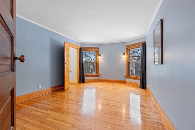 745 S Quincy St, Green Bay, WI 54301 - spare room with a healthy amount of sunlight, light wood-style flooring, and baseboards