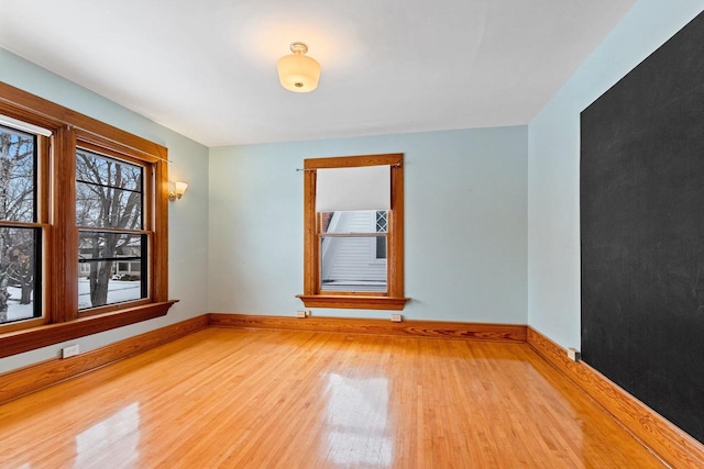 745 S Quincy St, Green Bay, WI 54301 - unfurnished room with baseboards and wood finished floors
