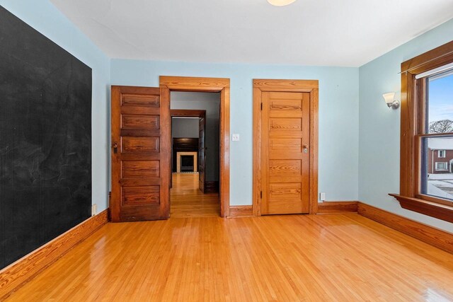 745 S Quincy St, Green Bay, WI 54301 - unfurnished room with light wood finished floors and baseboards