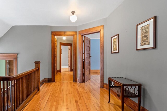 745 S Quincy St, Green Bay, WI 54301 - hall with light wood finished floors, an upstairs landing, and baseboards
