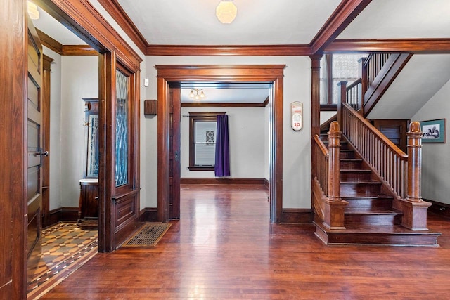 745 S Quincy St, Green Bay, WI 54301 - hall with baseboards, stairway, wood finished floors, and ornamental molding