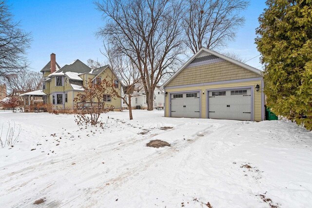 745 S Quincy St, Green Bay, WI 54301 - exterior space with a chimney and a detached garage