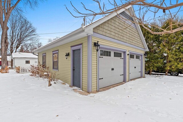 745 S Quincy St, Green Bay, WI 54301 - snow covered garage featuring a garage