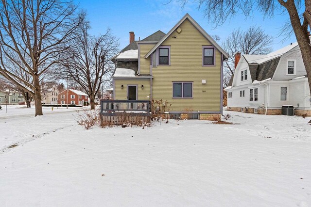 745 S Quincy St, Green Bay, WI 54301 - snow covered property featuring a chimney, central AC unit, and a deck
