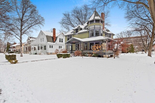 745 S Quincy St, Green Bay, WI 54301 - snow covered property with a chimney