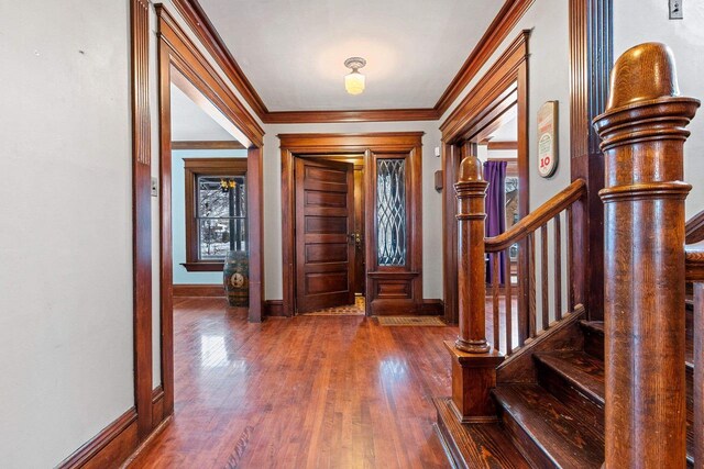 745 S Quincy St, Green Bay, WI 54301 - foyer entrance with stairway, a wealth of natural light, crown molding, baseboards, and hardwood / wood-style floors