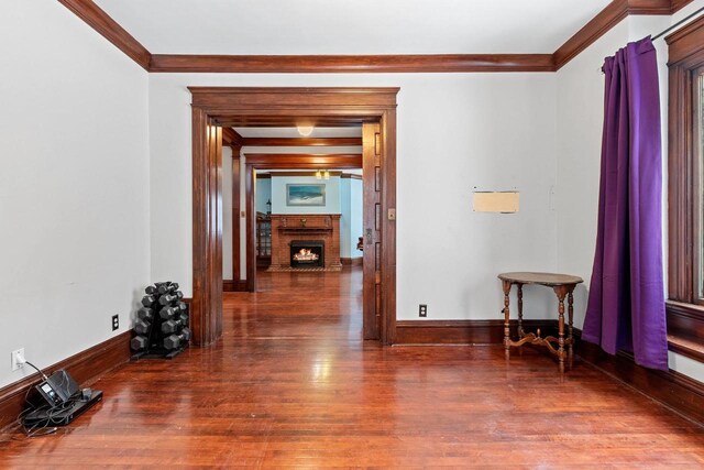 745 S Quincy St, Green Bay, WI 54301 - interior space featuring baseboards, wood finished floors, and crown molding