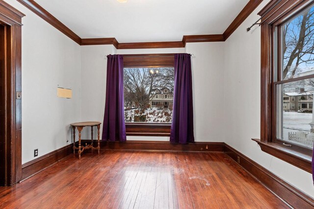 745 S Quincy St, Green Bay, WI 54301 - spare room with hardwood / wood-style flooring, ornamental molding, and plenty of natural light