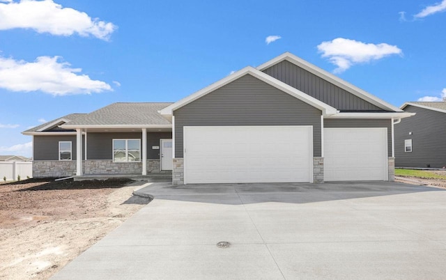 2081 Antelope Trl, Kaukauna, WI 54130 - ranch-style house with a garage, concrete driveway, and stone siding