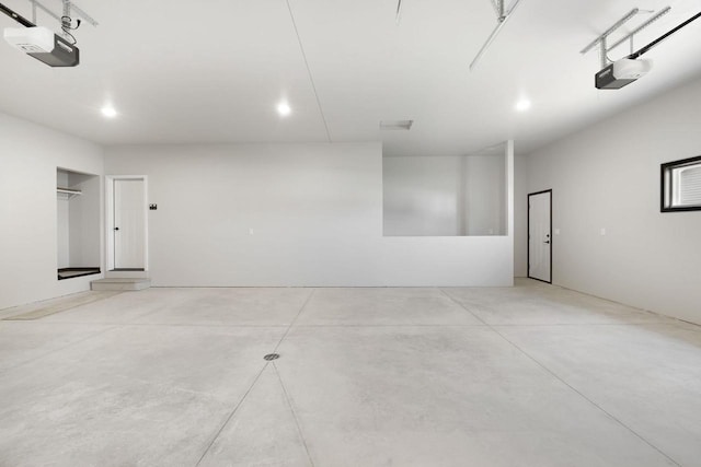 2081 Antelope Trl, Kaukauna, WI 54130 - garage featuring a garage door opener and recessed lighting