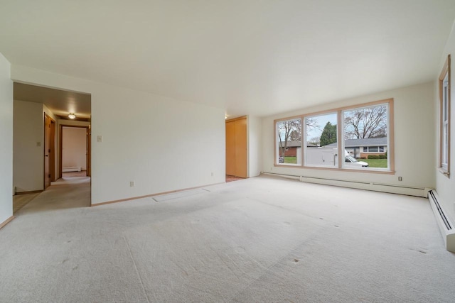 167 Gwynn St, Green Bay, WI 54301 - unfurnished room featuring a baseboard heating unit, light carpet, and baseboards