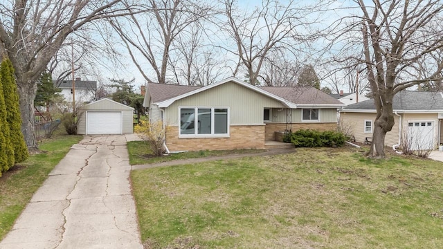 167 Gwynn St, Green Bay, WI 54301 - view of front of home with an outbuilding, a front lawn, a garage, and brick siding