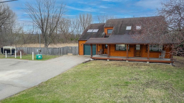 N7315 Winnebago Dr, Fond Du Lac, WI 54935 - view of front facade with asphalt driveway, covered porch, and roof with shingles