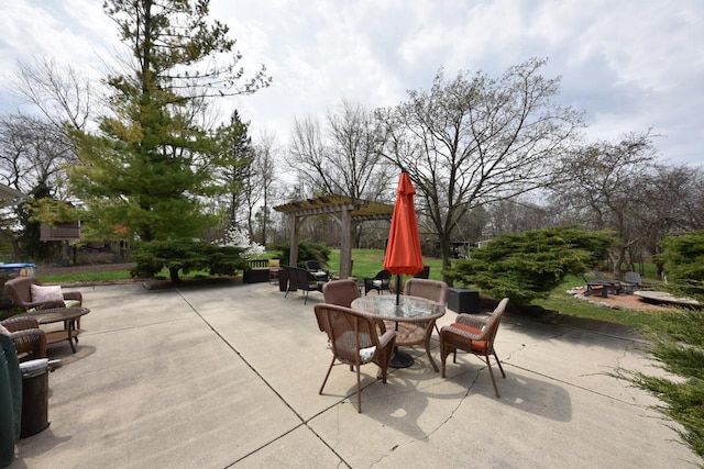 view of patio with a pergola and outdoor dining area