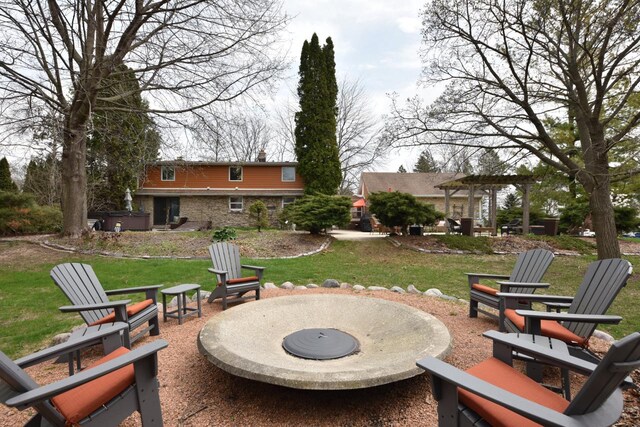 view of patio with a fire pit