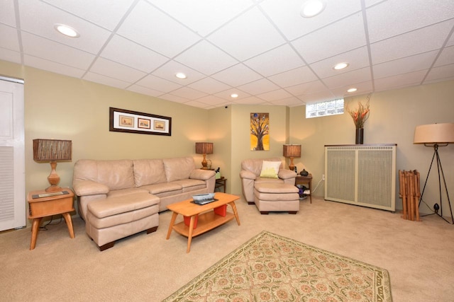 living room featuring recessed lighting, a paneled ceiling, and carpet