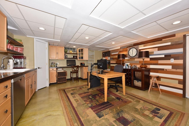 home office with recessed lighting, finished concrete flooring, and a sink