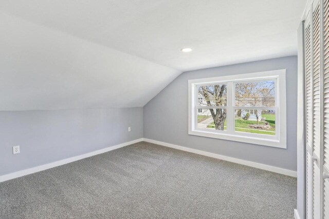 additional living space featuring baseboards, recessed lighting, carpet floors, and lofted ceiling
