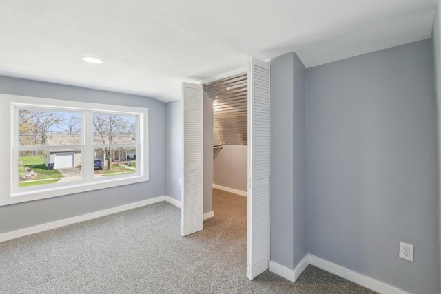 unfurnished bedroom featuring recessed lighting, baseboards, carpet, and a closet