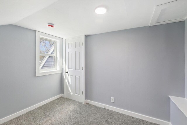 bonus room featuring baseboards, carpet, and vaulted ceiling