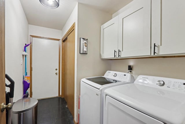 laundry area with cabinet space and independent washer and dryer