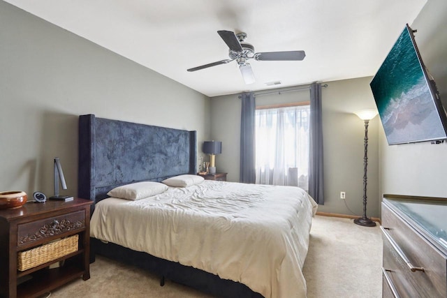 carpeted bedroom featuring baseboards, visible vents, and ceiling fan