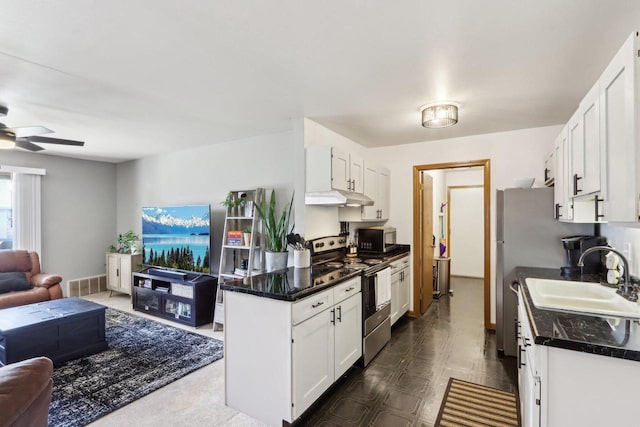 kitchen with under cabinet range hood, dark countertops, stainless steel electric range, a sink, and open floor plan