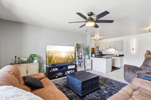 living area featuring ceiling fan