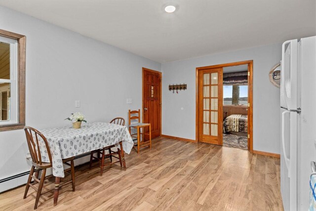 W2138 Melmar Dr, Markesan, WI 53946 - dining area featuring baseboards and light wood finished floors