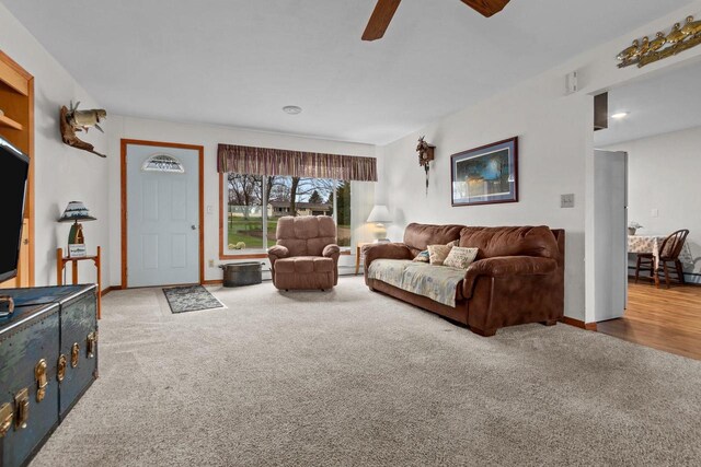 W2138 Melmar Dr, Markesan, WI 53946 - living room with a ceiling fan, baseboards, and carpet floors